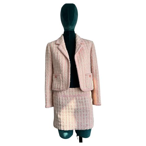 warm pink chanel|Chanel pink tweed suit.